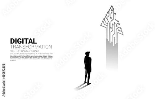 Silhouette of businessman standing with arrow from dot connect line circuit. concept of digital transformation of business.