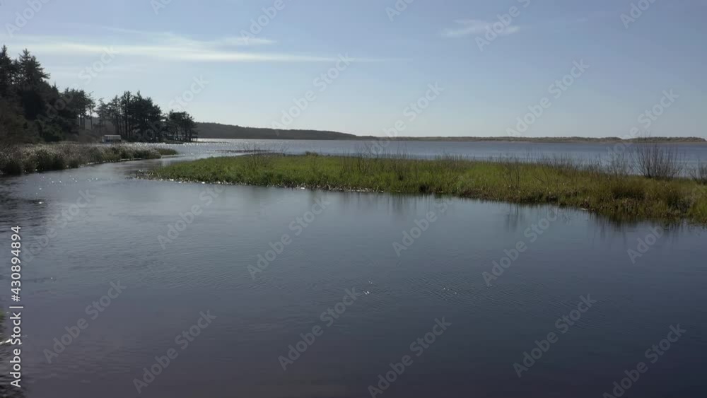 Aerial shot over Floras lake banks in Oregon. First-person forward ascending Aerial shot over Floras lake banks in Oregon. First-person forward ascending