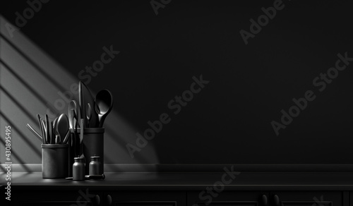 Dark kitchen counter and everyday utensils on  the counter in warm morning sunlight.  monochrome black color concept, solid and flat color scene, 3d Rendering. Morning Shine