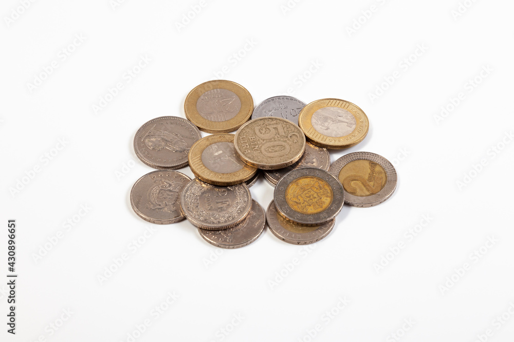 Heap of old coins of different countries on a white background Heap of old coins of different countries on a white background