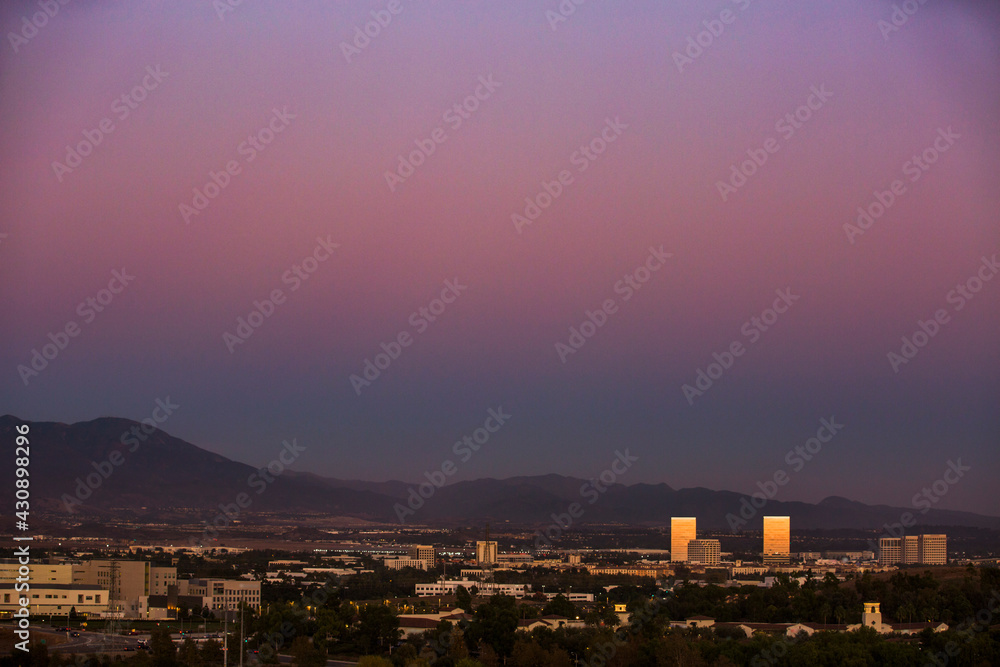 Sunset aerial view of the downtown skyline of Irvine, California, USA.