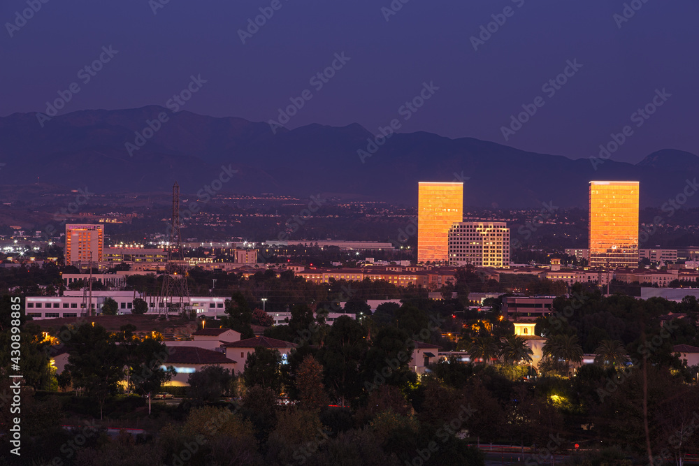 Nighttime view of the downtown skyline of Irvine, California, USA. - obrazy, fototapety, plakaty 