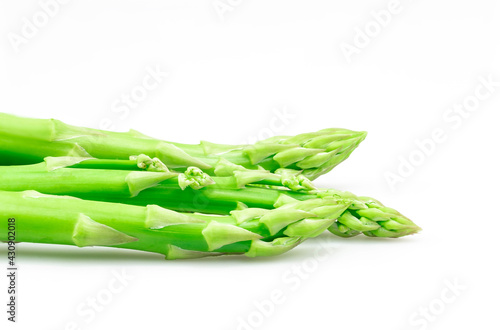 Fresh organic green asparagus (asparagus officinalis) isolated on white background, macro