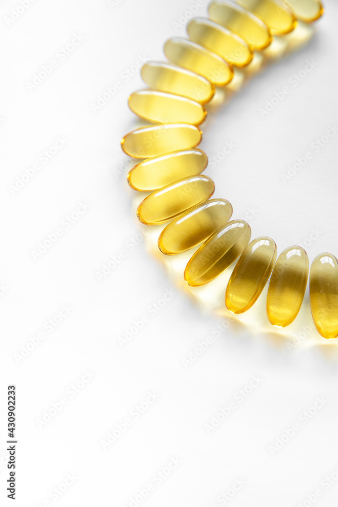 Obraz premium Close up of food supplement oil filled capsules suitable for: fish oil, omega 3, omega 6, omega 9, evening primrose, borage oil, flax seeds oil, vitamin A, vitamin D, vitamin D3, vitamin E.