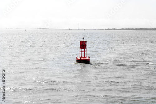 A red buoy in the water © Meghan