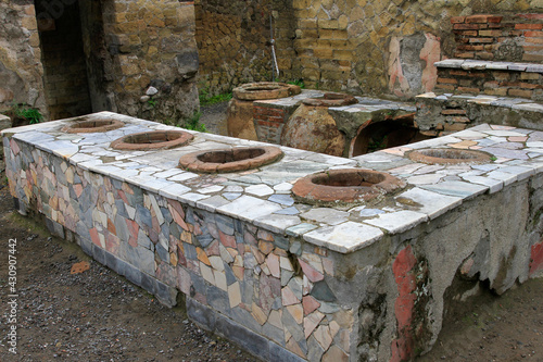 Ruins of stone restaurant food counter at Pompeii, Italy