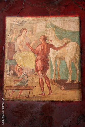 Ancient fresco of man with cow and woman, Pompeii, Italy 