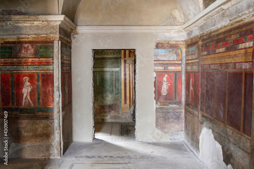 Colorful painted frescoes in the Villa of the Mysteries, Pompeii, Italy