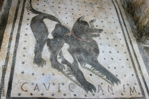 Cave canem Roman mosaic at the entrance to the House of the Tragic Poet in Pompeii, Italy