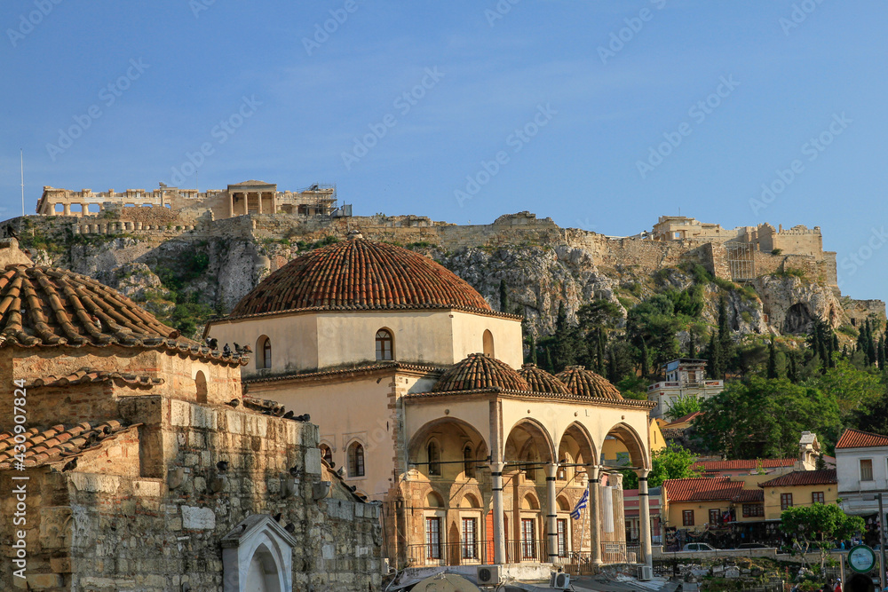 Fototapeta premium Tzistarakis Mosque with blue sky and Acropolis in background, Athens, Greece