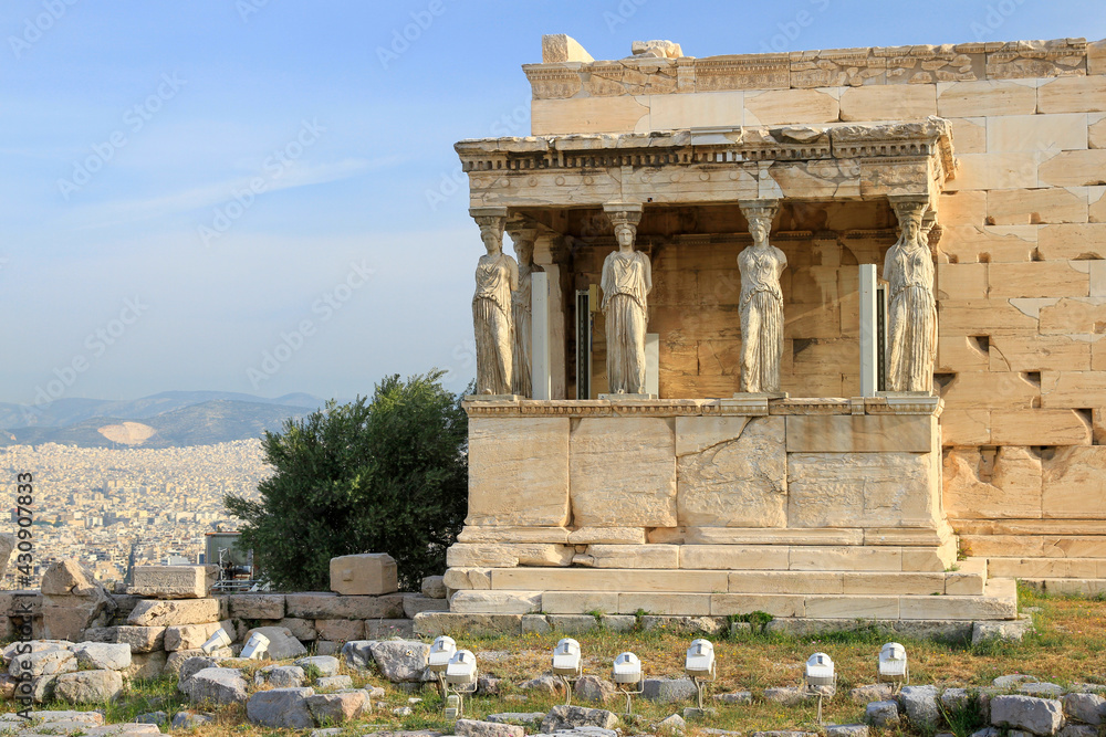 Porch of the Caryatids at the Erechtheion with city of Athens, Greece in background