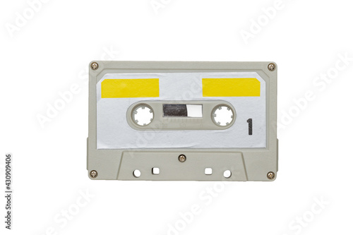 Gray-yellow retro tape recorder isolated on a white background.