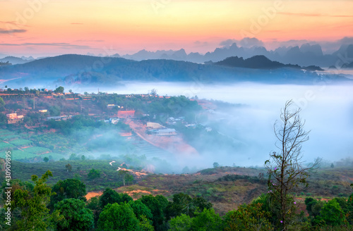 Dawn on plateau in morning covered by fog below, landscape so beautiful idyllic countryside Da Lat plateau, Vietnam