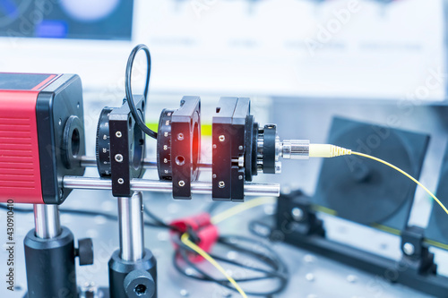 Experiment with laser device in optical laboratory