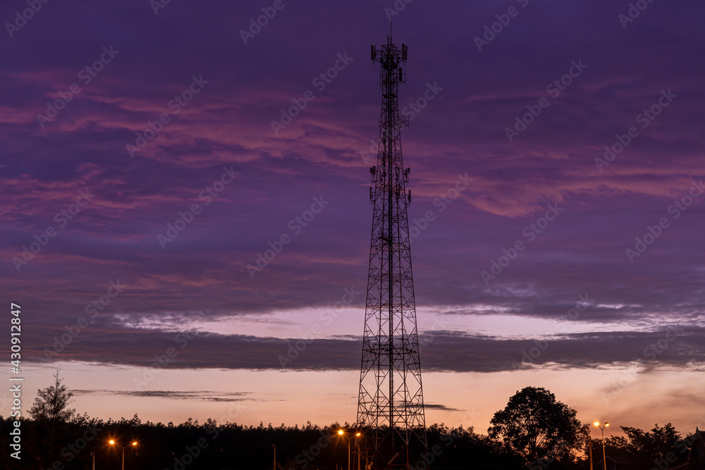 Fototapeta premium Mobile phone transmitter and receiver pole for best telephone signal with black cloud sky background.