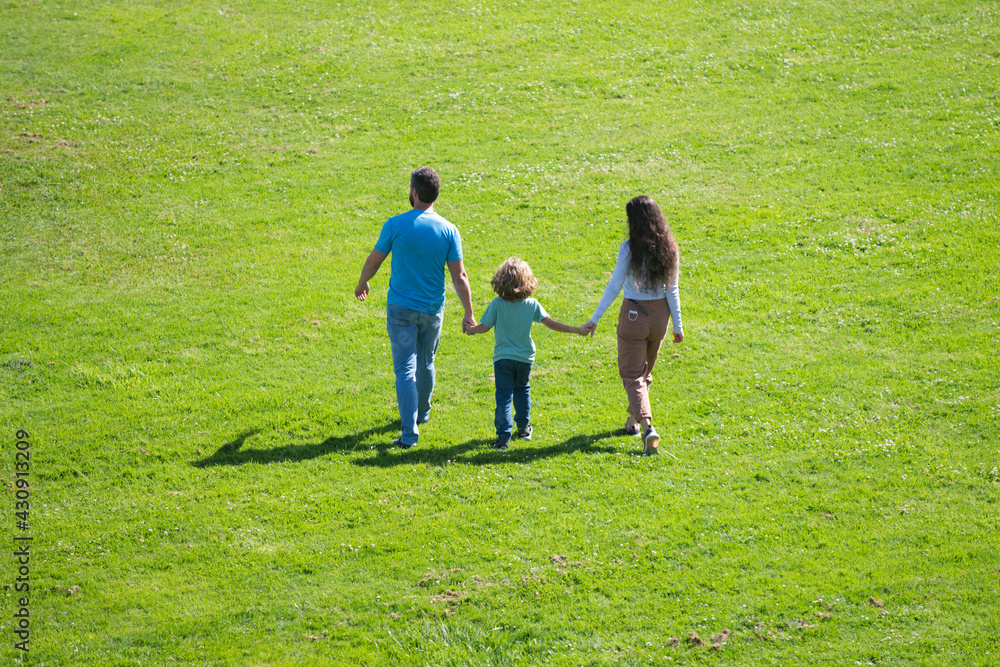 The concept of a happy family. Family leisure activities. Back view. The concept of a happy family. Family leisure activities. Back view.