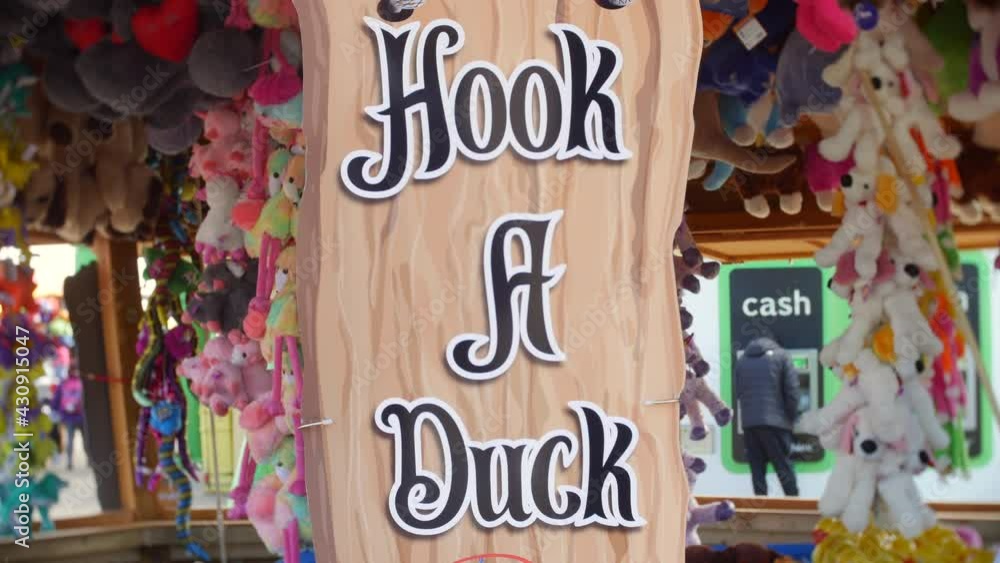Hook a duck fairground game. Classic fair amusements game at a British