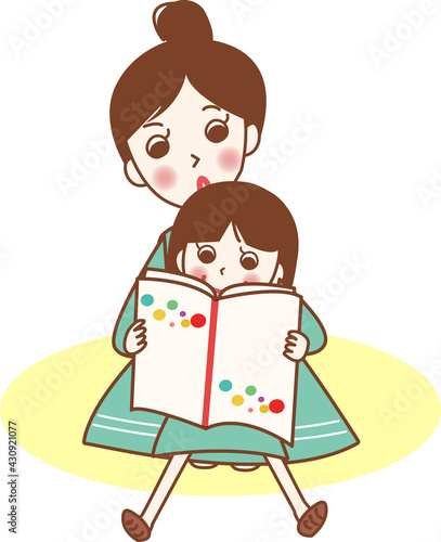 絵本の読み聞かせをする親子。