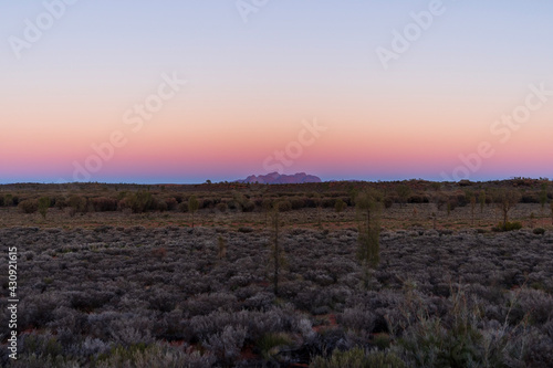 Panoramic view of Kata Tjuta (Mount Olga) on the horizon at sunrise. photo