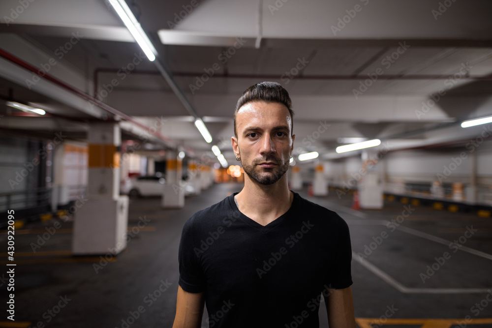 Portrait of handsome man at night at parking lot Portrait of handsome man at night at parking lot