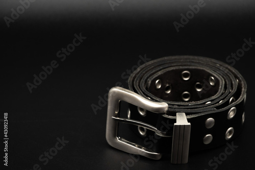 Fotografie black leather belt with studs for gothic punk, concept belt