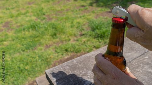 Bottle opener and beer bottle