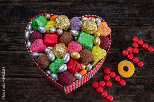 Box of chocolate and candy with heart shape