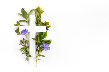 The Christianity cross of green leaves. Baptism, Easter, church holiday background