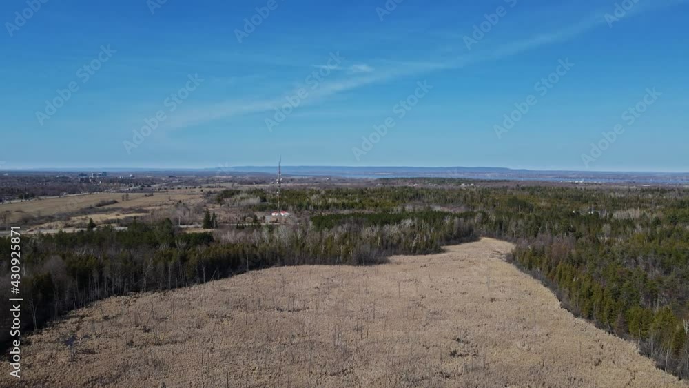 Ascending drone shot of a swamp with hills and a river in the background (Ottawa, Canada) Ascending drone shot of a swamp with hills and a river in the background (Ottawa, Canada)