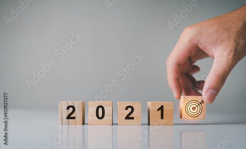 The blocks are placed with the text of 2021, meaning planning for the new year, setting life goals business distant the future with great vision ready to open a new things Innovation knowledge.