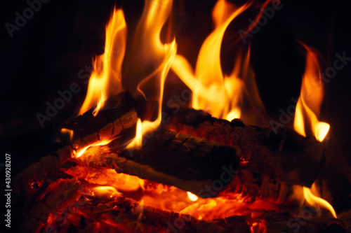 A fire burns in a fireplace, Fire to keep warm. Logs burning in a fireplace
