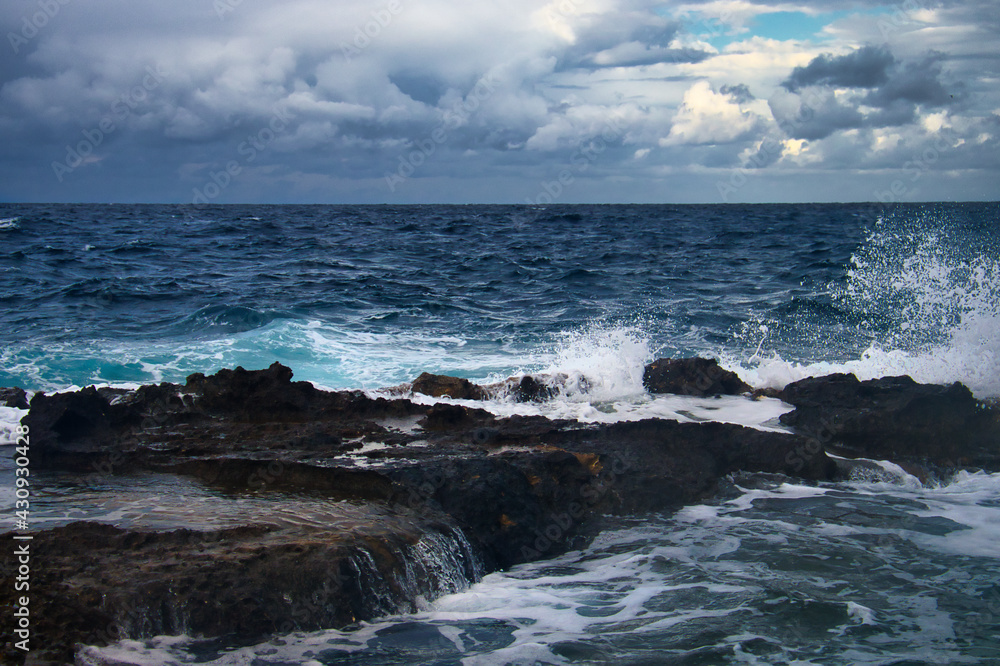 Ocean water splashing over rocks on a stormy day in Qawra, Malta. Ocean water splashing over rocks on a stormy day in Qawra, Malta.