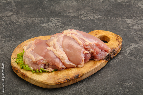 Raw chicken boneless and skinless leg photo