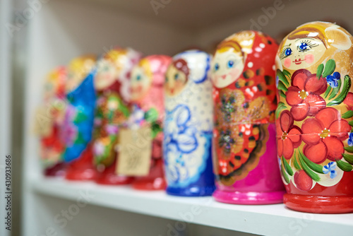 Row of multi-colored nesting dolls