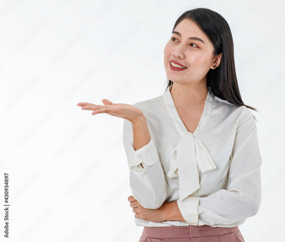 Asian beautiful business woman wear white shirt, smile with confidence, happiness and success, pose and make gesture of hand of showing or presenting isolated white background and copy space. Asian beautiful business woman wear white shirt, smile with confidence, happiness and success, pose and make gesture of hand of showing or presenting isolated white background and copy space.
