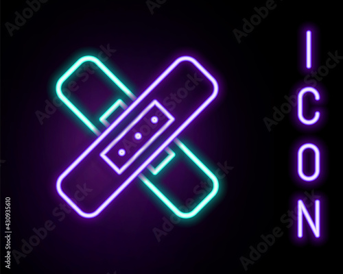 Glowing neon line Crossed bandage plaster icon isolated on black background. Medical plaster, adhesive bandage, flexible fabric bandage. Colorful outline concept. Vector