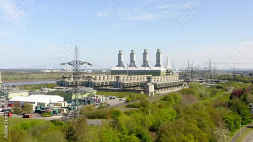 Flint power station in Wales UK. Long slow drone shot with cinematic tilt up. photo