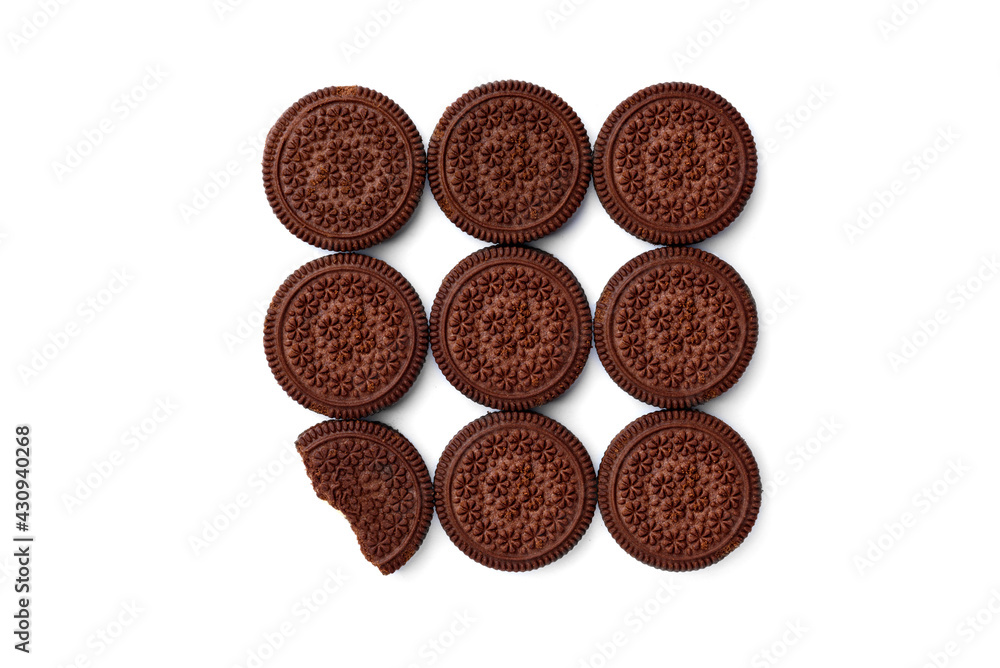 Chocolate cookies with milk filling isolated on white background. Top view. Chocolate cookies with milk filling isolated on white background. Top view.