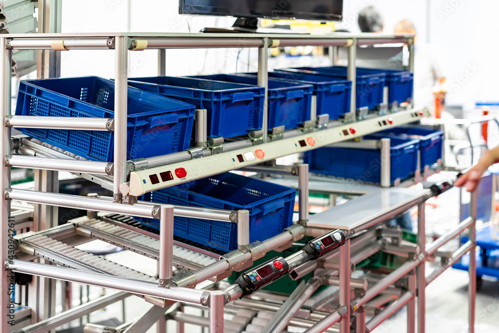 basket or plastic box container on roller rack or aluminum shelf with electronic display smart module system for management – control or operate stock such as quantity and data information etc.