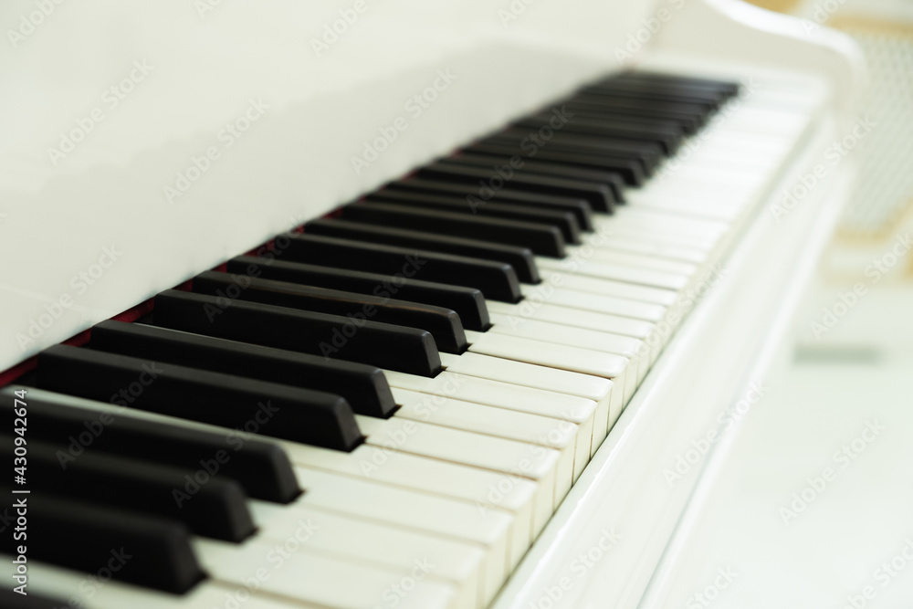 white grand piano with keys close-up. classical music white grand piano with keys close-up. classical music