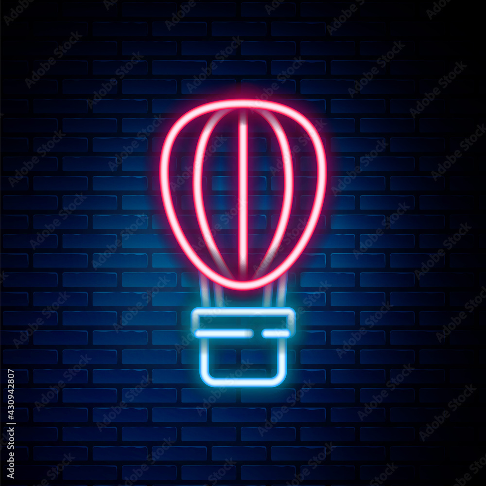 Obraz premium Glowing neon line Hot air balloon icon isolated on brick wall background. Air transport for travel. Colorful outline concept. Vector