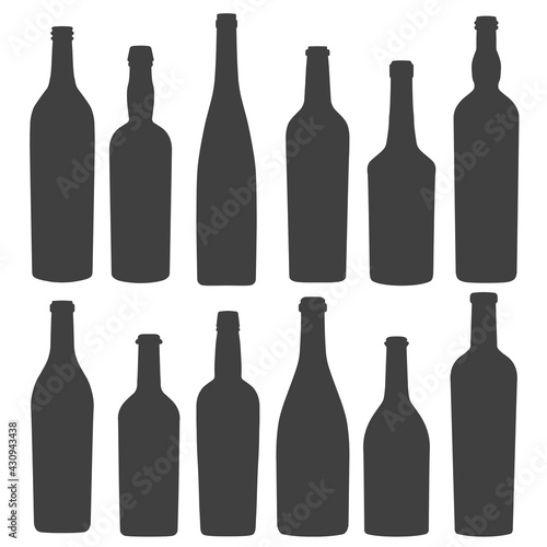 Set of silhouettes of vintage wine bottles isolated on white background. Vector illustration.