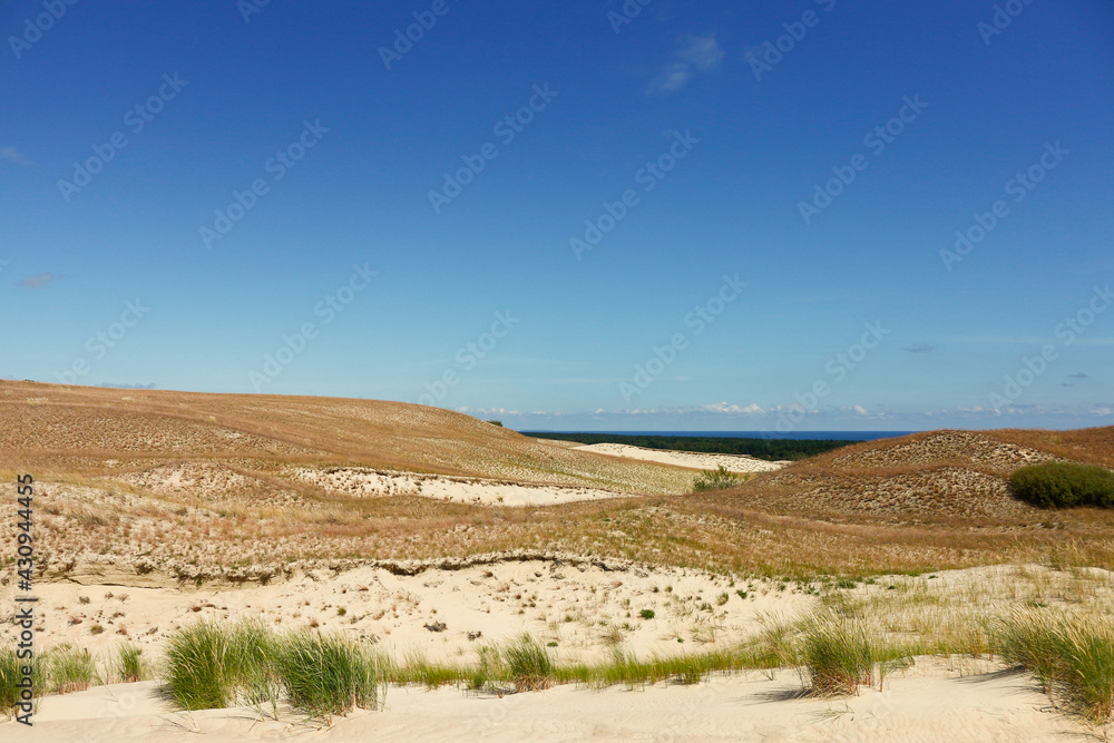 Beautiful landscape with sand dunes and blue sky Beautiful landscape with sand dunes and blue sky