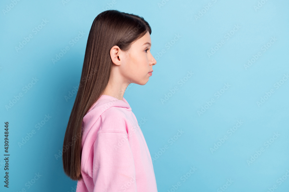Profile side view portrait of attractive content girl copy empty place space isolated over bright blue color background Profile side view portrait of attractive content girl copy empty place space isolated over bright blue color background