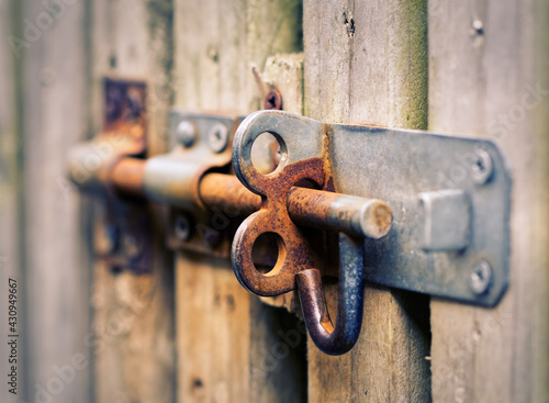 old rusty lock on wooden doors 