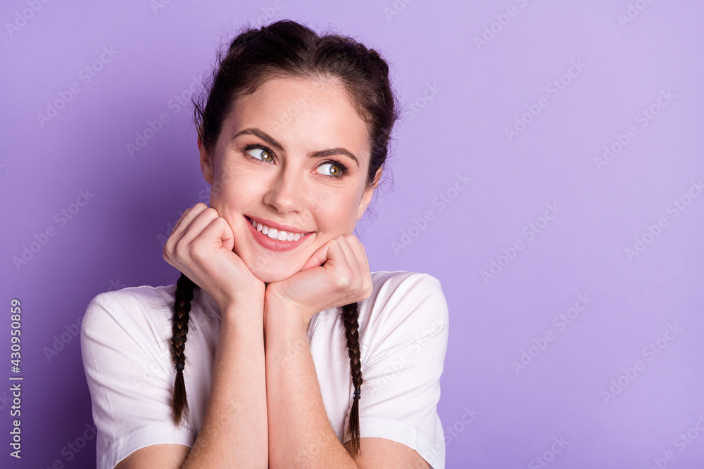 Photo of attractive dreamy young woman good mood smile look empty space isolated on purple color background Photo of attractive dreamy young woman good mood smile look empty space isolated on purple color background