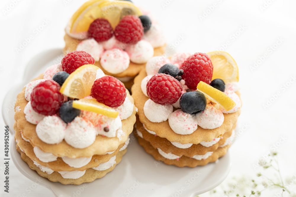 selection of sweet baked cream edible flowers and fruit dessert cakes for mothersday, wedding, birthday, paerty celebration. viola odorata cake. selection of sweet baked cream edible flowers and fruit dessert cakes for mothersday, wedding, birthday, paerty celebration. viola odorata cake.