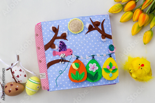 Handmade textile book for baby. Easter present for baby. Pages with felt eggs, birds and rabbits. Woolly toys on a string. Baby development. Educational toys. Fine motor skills.