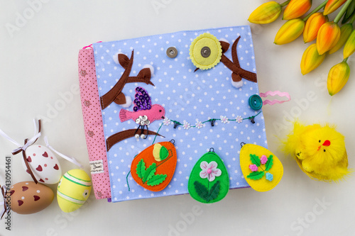 Handmade textile book for baby. Easter present for baby. Pages with felt eggs, birds and rabbits. Woolly toys on a string. Baby development. Educational toys. Fine motor skills.