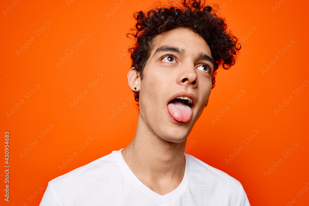 guy with curly hair in a white t-shirt emotion grimace guy with curly hair in a white t-shirt emotion grimace